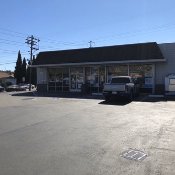 Quik Stop - a truck parked in front of a store - Gas Stations Near Me - Vallejo, California