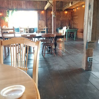 The Root - a table and chairs in a rustic restaurant - Breakfast & Brunch Near Me - Temple, New Hampshire