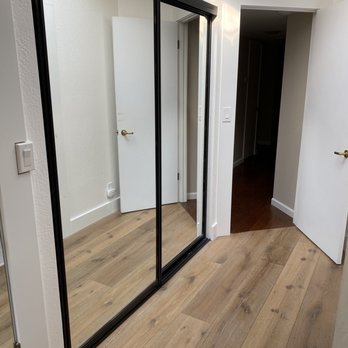 Pristine Painting - Installed new engineered hardwood floors, new baseboards & trim, updated gold mirrored closet doors by painting trim black. - Painters Near Me