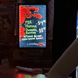 a neon sign in a bar a neon sign in a bar