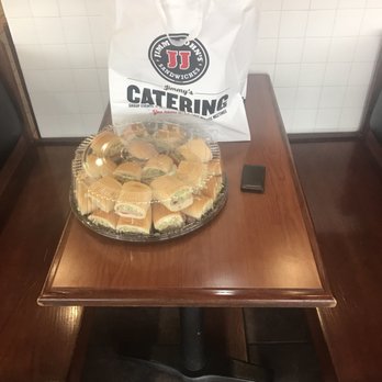 Jimmy John's - a table with a pie and a bag of catering - Sandwiches Near Me - St. Joseph, Missouri