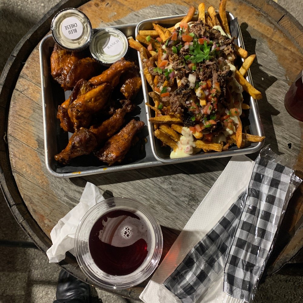 Lillie's Q - a tray of food and a glass of wine - Barbeque Near Me - Chicago, Illinois Lillie's Q - a tray of food and a glass of wine - Barbeque Near Me - Chicago, Illinois