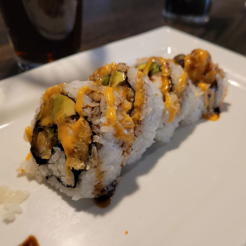 Sake Sushi - a piece of sushi on a white plate - Sushi Bars Near Me - Chaska, Minnesota