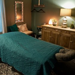 Sage Massage Studio - Tranquility awaits in our soothing massage room.