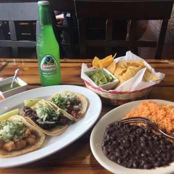 La Casa de Los Tacos - Three tacos combo (chicken, beef, chorizo) with rice and beans, small guac and chips and a grapefruit soda. - Tacos Near Me - Secaucus, New Jersey