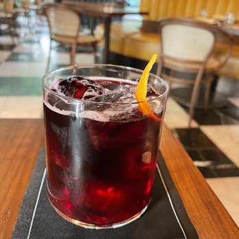 Carlino Restaurant - a glass of red wine on a table - Italian Near Me - Vancouver, British Columbia