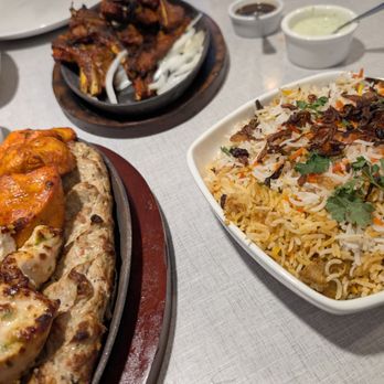 Aga's Restaurant & Catering - Chicken Platter and Chicken Biryani in front with Grilled Chop and another Chicken Biryani in back - Pakistani Near Me - Houston, Texas Aga's Restaurant & Catering - Chicken Platter and Chicken Biryani in front with Grilled Chop and another Chicken Biryani in back - Pakistani Near Me - Houston, Texas