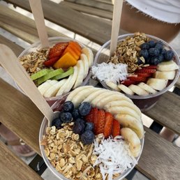 two bowls of fruit and oatmeal