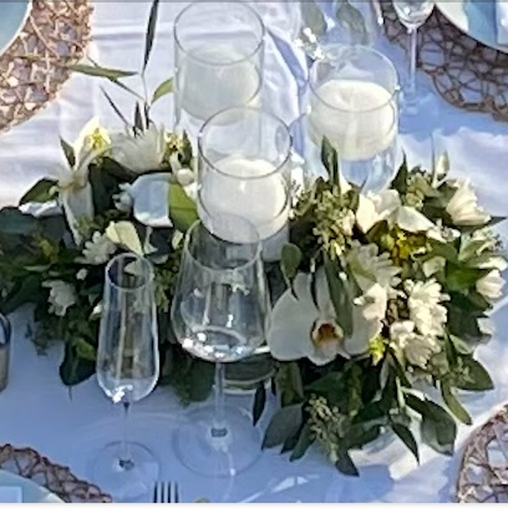 Franco's Flowers - Arrangement surrounding cylinder vases with floating candles - Florists Near Me - Encinitas, California
