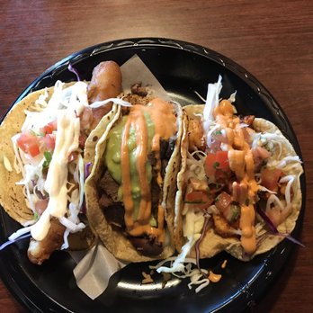 Taco Bar - Left to right: Battered fish, Surf n turf, spicy shrimp. - Mexican Near Me - San Marcos, California Taco Bar - Left to right: Battered fish, Surf n turf, spicy shrimp. - Mexican Near Me - San Marcos, California