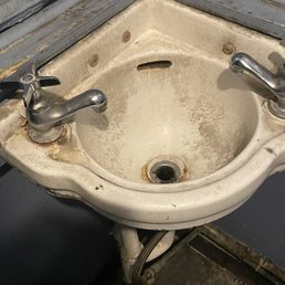 a dirty sink in a bathroom a dirty sink in a bathroom