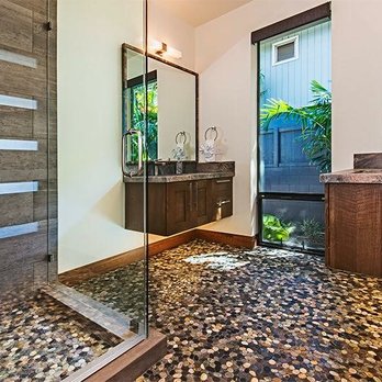 Go Construction - a modern bathroom with a glass shower - General Contractors Near Me - Tarzana, California