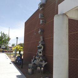 Erna Fergusson Library - The front wall of the library with "waterfall" of letters