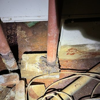 Tomlinson Home Inspection - Structural Alert: Rusted-out bassment Lolly columns. Moisture at the base compromises the home's support. We catch the foundation issues. - Home Inspectors Near Me Tomlinson Home Inspection - Structural Alert: Rusted-out bassment Lolly columns. Moisture at the base compromises the home's support. We catch the foundation issues. - Home Inspectors Near Me