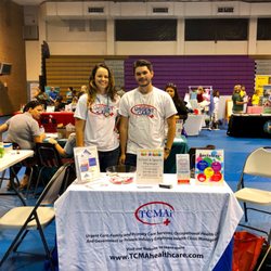 Okeechobee Urgent Care - Austin and Catherine at the Okeechobee Back to School Bash