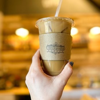 Coffin House Coffee - a hand holding a cup of coffee - Coffee & Tea Near Me - Concord, North Carolina