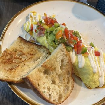 Brunch by De Martino - Carne Asada Omelet with a side sourdough bread - Latin American Near Me - Somerville, New Jersey Brunch by De Martino - Carne Asada Omelet with a side sourdough bread - Latin American Near Me - Somerville, New Jersey