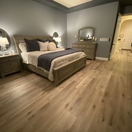 Master bedroom with Whispering Wheat flooring.