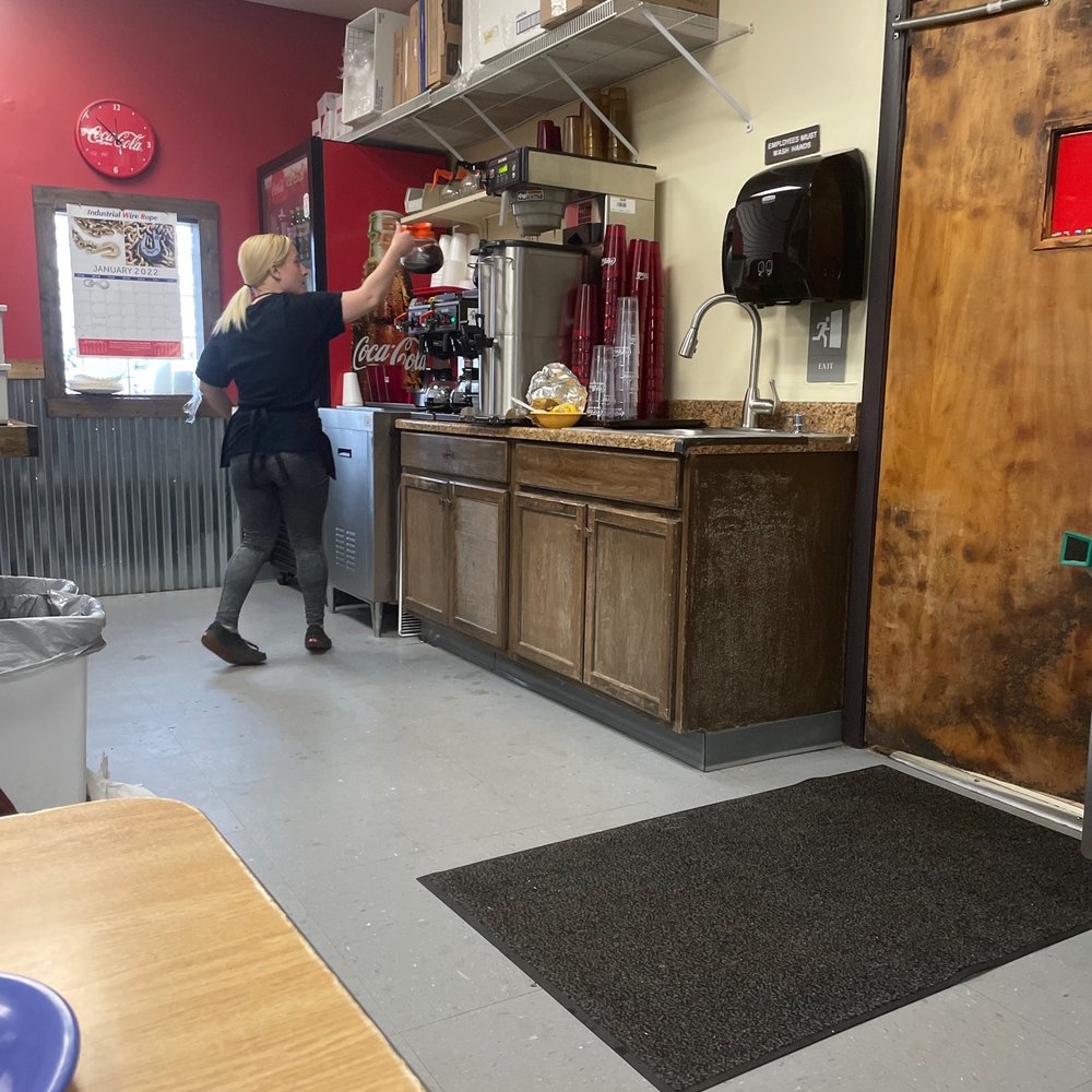 Sunnyside Grill - a woman preparing food in a restaurant - American Near Me - Cleves, Ohio Sunnyside Grill - a woman preparing food in a restaurant - American Near Me - Cleves, Ohio
