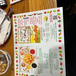 a menu and a plate of food