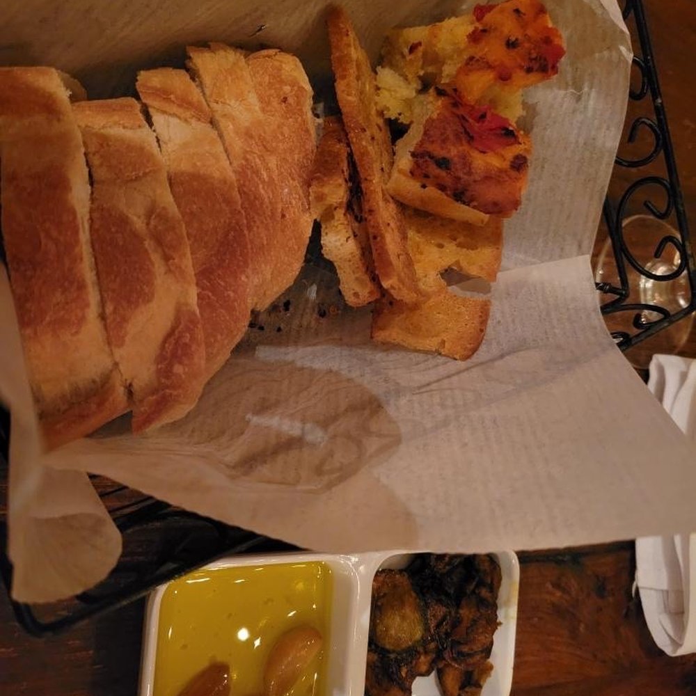 Osteria Cucina Rustica - Bread at the table- selection of focaccia, crostini with garlic oil - Italian Near Me - Marlboro, New Jersey Osteria Cucina Rustica - Bread at the table- selection of focaccia, crostini with garlic oil - Italian Near Me - Marlboro, New Jersey