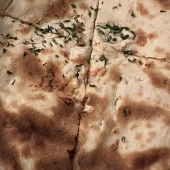 India Palace - a flat bread with herbs on it - Indian Near Me - Cookeville, Tennessee India Palace - a flat bread with herbs on it - Indian Near Me - Cookeville, Tennessee