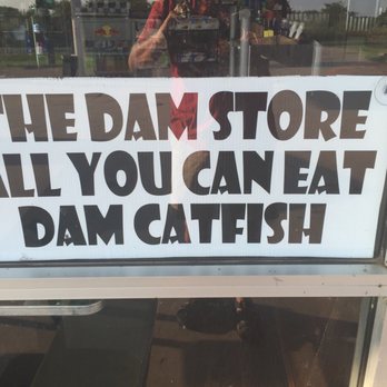 The Dam Store - a sign in the window - Convenience Stores Near Me - Aubrey, Texas
