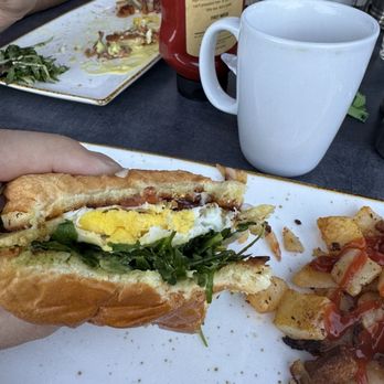 First Watch - Breakfast Sandwich with a not so over medium egg... - American Near Me - Queen Creek, Arizona