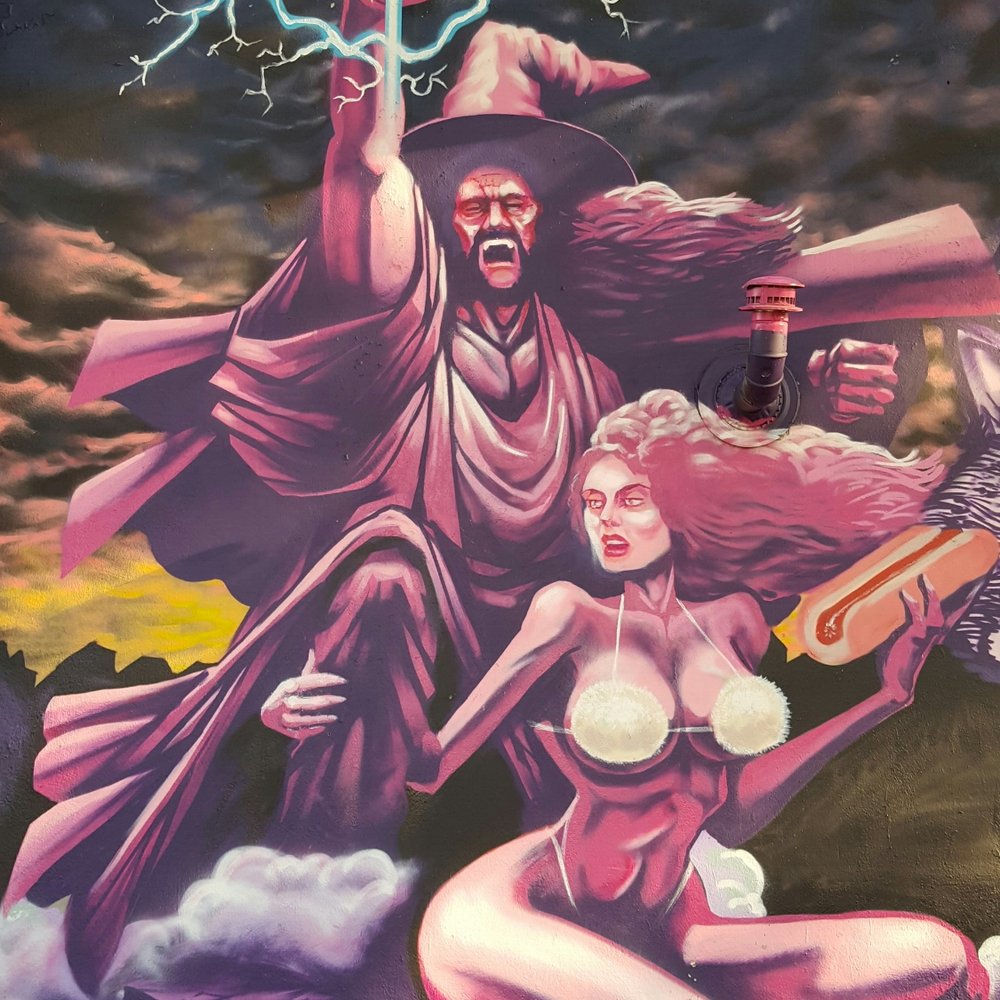 Moon Tower - Seating area mural. - Dive Bars Near Me - Houston, Texas