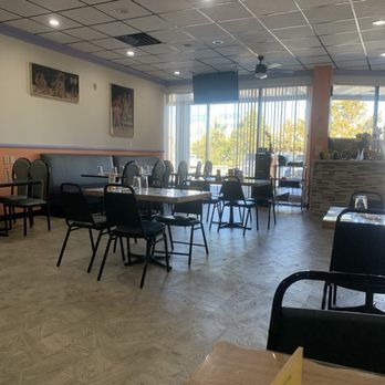 Taj India Grill - The other side of the dining room and shows the checkout counter. Tables and booths behind large, bright window. - Indian Near Me - Chattanooga, Tennessee Taj India Grill - The other side of the dining room and shows the checkout counter. Tables and booths behind large, bright window. - Indian Near Me - Chattanooga, Tennessee