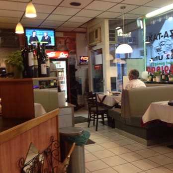 Pizzeria La Piccola - The front sitting area with TV - Pizza Near Me - Cologne, NW Pizzeria La Piccola - The front sitting area with TV - Pizza Near Me - Cologne, NW
