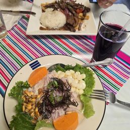 Ceviche and Chicha morada in rhe front Lomo saltado in the back. Everything was top notch! Ceviche and Chicha morada in rhe front Lomo saltado in the back. Everything was top notch!