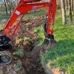 Krebs Kubota - Flawlessly got the old water main out and new trench put in along this 600' tree line.