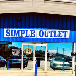 Simple Outlet - Entrance. Large Parking lot. Wheelchair accessible. Shopping carts available inside.