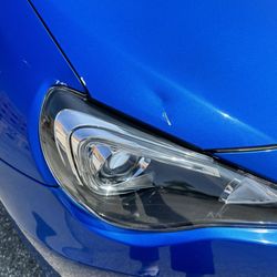 JL Dent Removal - Before the repair. Dented hood and bent side fender on the passenger's side.