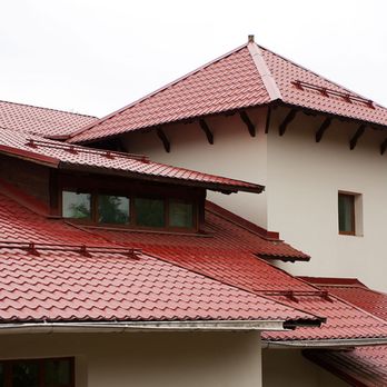 Edificium Construction - a house with a red roof - Roofing Near Me - Vero Beach, Florida Edificium Construction - a house with a red roof - Roofing Near Me - Vero Beach, Florida