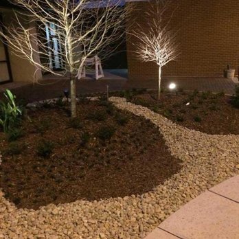 Outdoor Concepts - a landscaped garden at night - Lawn Services Near Me Outdoor Concepts - a landscaped garden at night - Lawn Services Near Me
