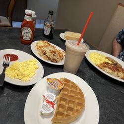 Waffle, Scrambled eggs, Strawberry-Banana smoothie with matcha, sausage, and sourdough toast