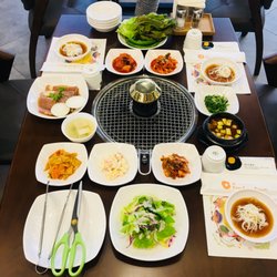 Kang Kang Sullai - Sample side dishes and salad serving to all customers