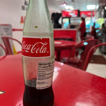 Tacos El Porky - A coke bottle. - Tacos Near Me - Miami, Florida Tacos El Porky - A coke bottle. - Tacos Near Me - Miami, Florida