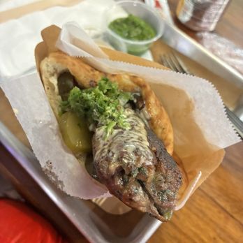 Miznon - Pass. Lamb Kebab Pita: minced lamb kebab, grilled onions/tomatoes, tahini, and spicy peppers - Venues & Event Spaces Near Me - Los Angeles, California
