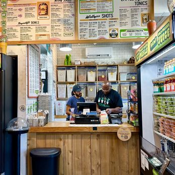 JuiceLand - a man working at a counter - Juice Bars & Smoothies Near Me - Houston, Texas