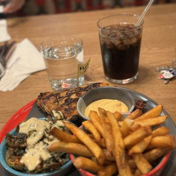 Nando's Peri-Peri - 1/4 chicken thigh with Brussels and fries - Chicken Shop Near Me - Houston, Texas