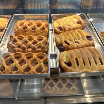 Cafe Arts - a variety of pastries in a display case - Coffee & Tea Near Me - Sarasota, Florida