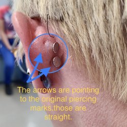 Action Tattoo - This is the magnified, marked up version pointing out the previous piercings and noting the placement of the new piercings.