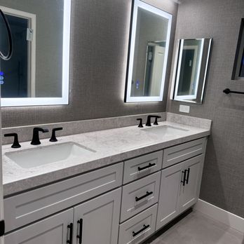 Nay Remodeling & Construction - Dual vanity sink custom make white make up mirror and wall paper on the walls - General Contractors Near Me Nay Remodeling & Construction - Dual vanity sink custom make white make up mirror and wall paper on the walls - General Contractors Near Me
