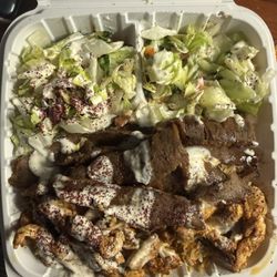 Lamb and chicken over rice with extra salad sub for fries. So good