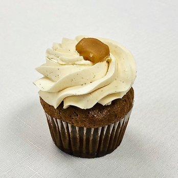 Cupcake Bakery - November cupcake has apple compote inside a spiced cake, topped with caramel-apple cider Italian buttercream! - Cupcakes Near Me - Eagan, Minnesota Cupcake Bakery - November cupcake has apple compote inside a spiced cake, topped with caramel-apple cider Italian buttercream! - Cupcakes Near Me - Eagan, Minnesota