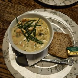 Tasty seafood chowder with a slice of sourdough bread and butter. Tasty seafood chowder with a slice of sourdough bread and butter.