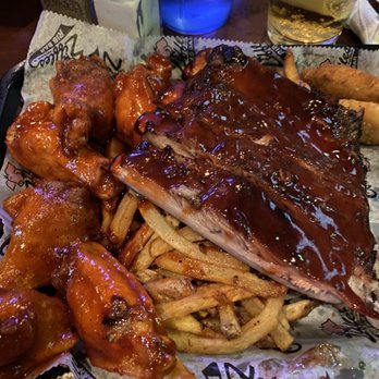 Ziffle's Rib Bar - Pig Out Platter featuring quarter slab of ribs, 6 wings, fries, cheese sticks and jalapeño poppers! - Barbeque Near Me - Fort Wayne, Indiana Ziffle's Rib Bar - Pig Out Platter featuring quarter slab of ribs, 6 wings, fries, cheese sticks and jalapeño poppers! - Barbeque Near Me - Fort Wayne, Indiana